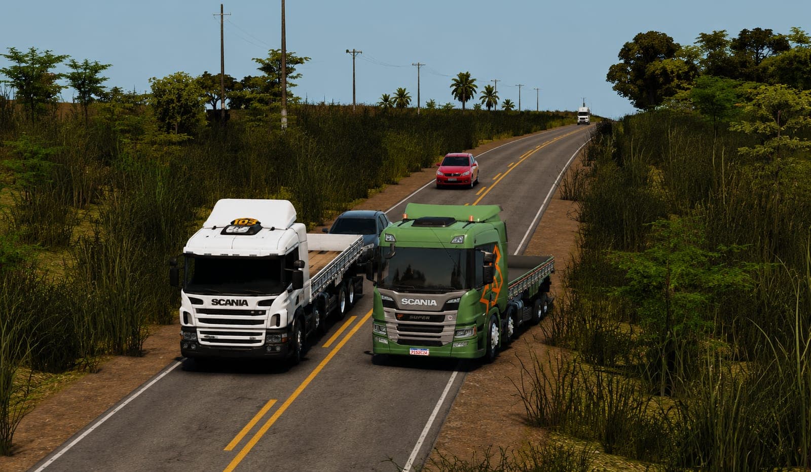 Scania branco e Scania Super verde lado a lado na rodovia